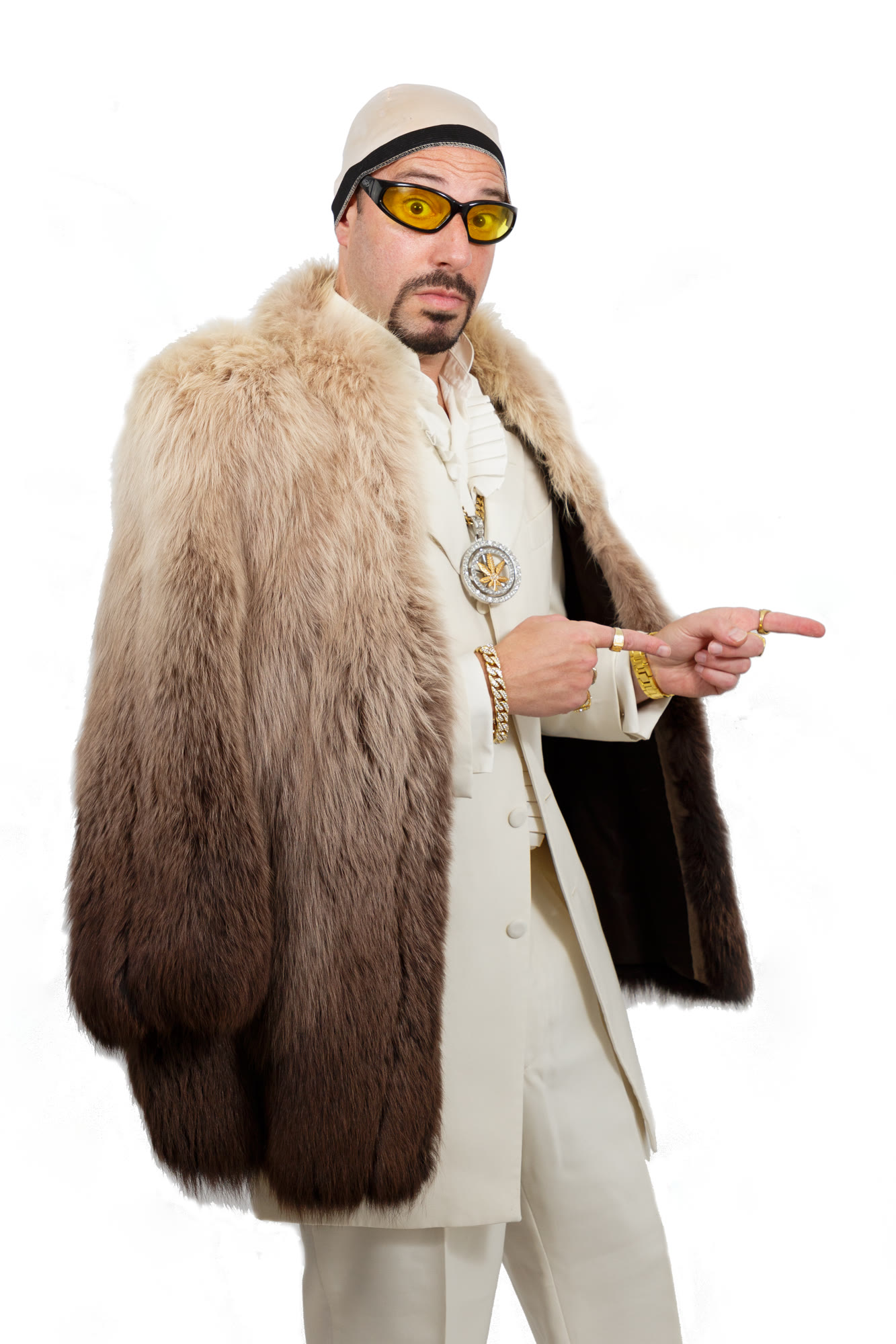Ali G pointing in the fur coat